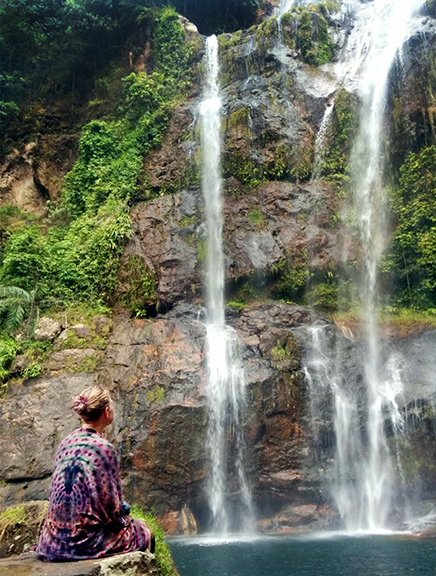 Girl in front of waterfall